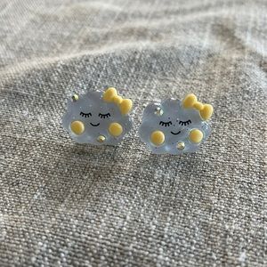 Blue smiling cloud post earrings with yellow bow and rhinestones
